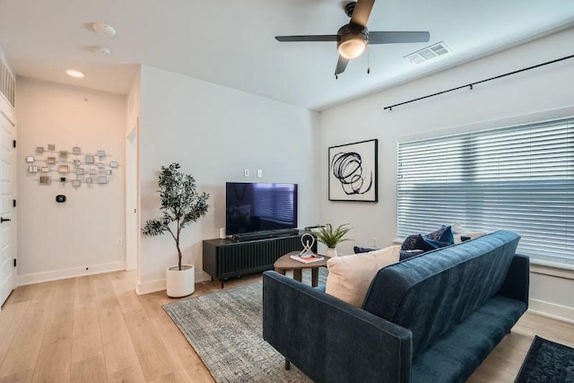 3101 Govalle Ave Unit 103, Austin, TX 78702 - living room featuring healthy amount of natural light, a ceiling fan, and light wood finished floors