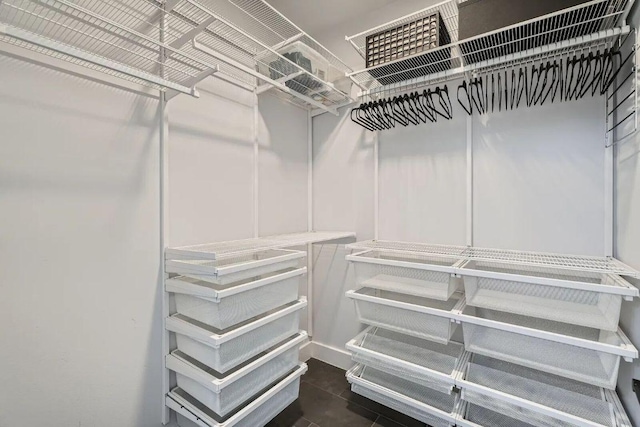 3101 Govalle Ave Unit 103, Austin, TX 78702 - spacious closet featuring dark tile patterned floors