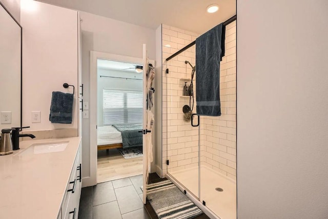 3101 Govalle Ave Unit 103, Austin, TX 78702 - bathroom featuring ensuite bathroom, a shower stall, tile patterned floors, vanity, and recessed lighting