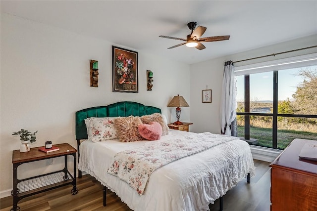 3216 Poe Cv Unit 5D, Lago Vista, TX 78645 - bedroom with wood finished floors and a ceiling fan