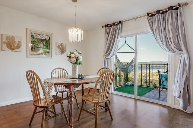 3216 Poe Cv Unit 5D, Lago Vista, TX 78645 - dining area featuring wood finished floors and a chandelier