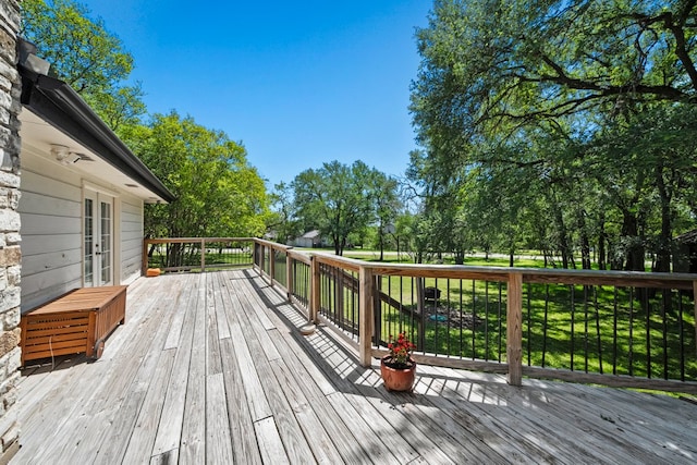 703 Stagecoach Trl, San Marcos, TX 78666 - wooden terrace featuring french doors and view of wooded area
