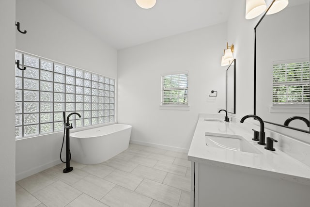 703 Stagecoach Trl, San Marcos, TX 78666 - bathroom featuring a soaking tub and double vanity