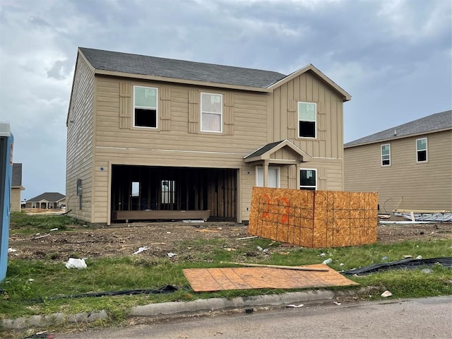 202 Fred Patrick Dr, Killeen, TX 76542 - view of front of home with board and batten siding, an attached garage, and a shingled roof