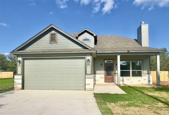 142 E Pauwela Ln, Bastrop, TX 78602 - view of front of home featuring concrete driveway, an attached garage, a chimney, and a shingled roof