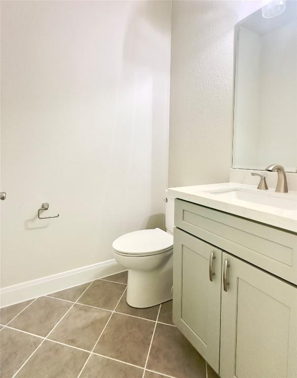 142 E Pauwela Ln, Bastrop, TX 78602 - half bath featuring vanity and tile patterned floors