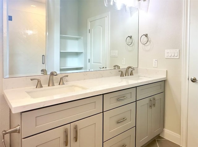 142 E Pauwela Ln, Bastrop, TX 78602 - bathroom with double vanity and tile patterned floors
