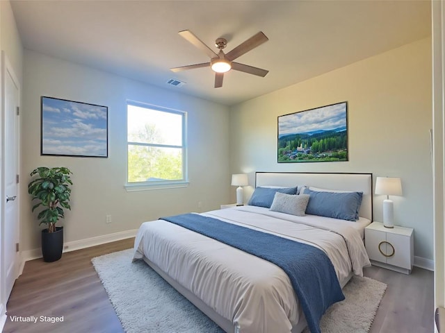 142 E Pauwela Ln, Bastrop, TX 78602 - bedroom featuring wood finished floors and ceiling fan