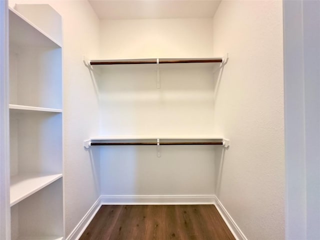 142 E Pauwela Ln, Bastrop, TX 78602 - walk in closet featuring dark wood-style floors