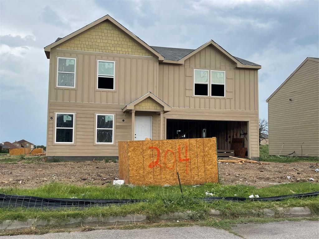 204 Fred Patrick Dr, Killeen, TX 76542 - view of front of house with board and batten siding and a garage