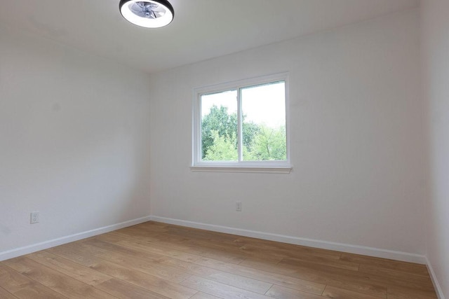 1402 Monica St, Austin, TX 78758 - empty room with light wood-style floors and baseboards