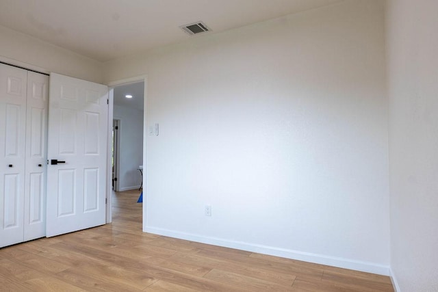 1402 Monica St, Austin, TX 78758 - unfurnished bedroom with light wood-type flooring and a closet