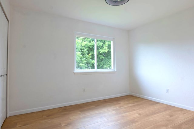 1402 Monica St, Austin, TX 78758 - empty room featuring light wood-style flooring