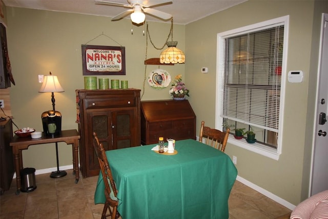 201 E Noton St Unit 105, Pflugerville, TX 78660 - tiled dining room featuring a ceiling fan and baseboards