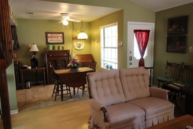 201 E Noton St Unit 105, Pflugerville, TX 78660 - living room featuring a ceiling fan and light wood-type flooring