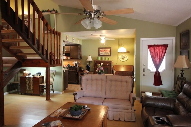 201 E Noton St Unit 105, Pflugerville, TX 78660 - living area featuring a ceiling fan, vaulted ceiling, light wood-style floors, and stairway