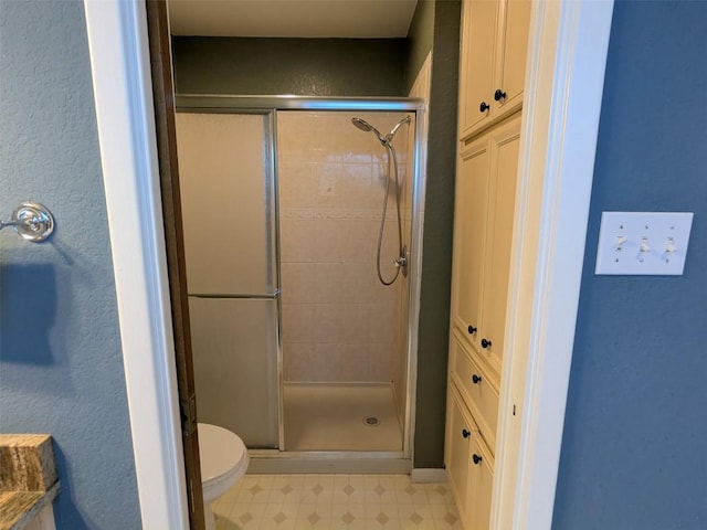 201 E Noton St Unit 105, Pflugerville, TX 78660 - full bathroom with a shower stall, tile patterned floors, and a textured wall