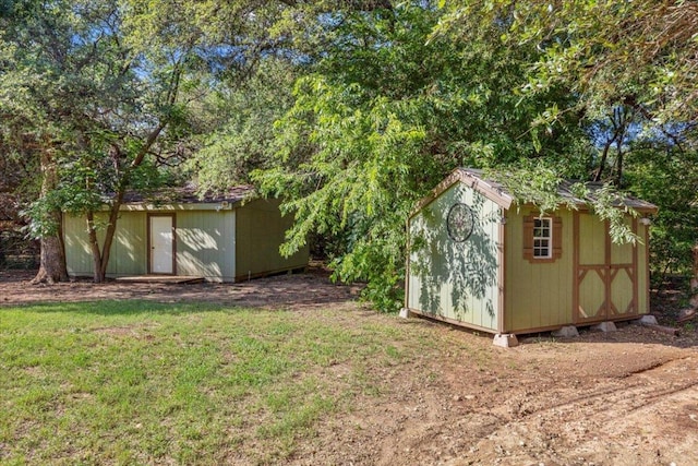 111 Lazy Trail Ct, Liberty Hill, TX 78642 - view of green lawn featuring a storage shed