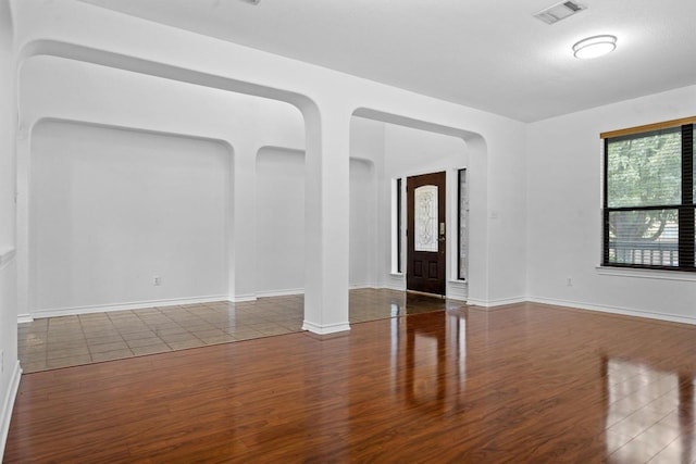 605 Whistlers Walk Trl, Cedar Park, TX 78613 - empty room featuring wood finished floors and arched walkways
