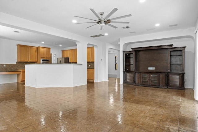 605 Whistlers Walk Trl, Cedar Park, TX 78613 - unfurnished living room featuring a ceiling fan, arched walkways, and recessed lighting