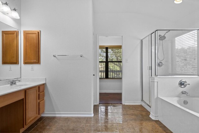 605 Whistlers Walk Trl, Cedar Park, TX 78613 - bathroom featuring a stall shower, vanity, a bath, and vaulted ceiling
