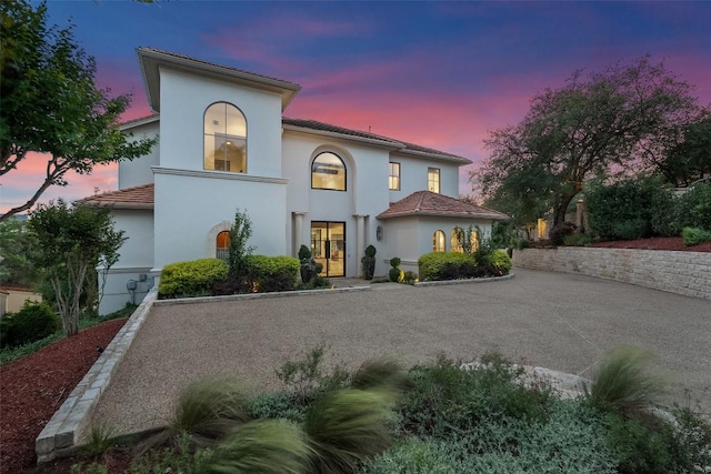 1508 Mesa Ridge Ln, Austin, TX 78735 - mediterranean / spanish-style house featuring stucco siding, a tile roof, and driveway