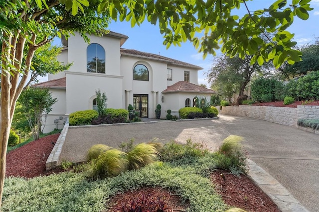 1508 Mesa Ridge Ln, Austin, TX 78735 - mediterranean / spanish-style home with stucco siding and a tiled roof