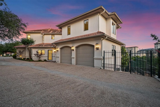 1508 Mesa Ridge Ln, Austin, TX 78735 - mediterranean / spanish house featuring an attached garage, stucco siding, and driveway
