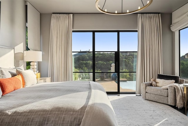 1508 Mesa Ridge Ln, Austin, TX 78735 - bedroom featuring a chandelier and access to outside