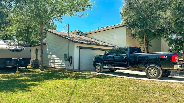 177 Mokulua Ln, Bastrop, TX 78602 - view of home's exterior with a garage and a yard