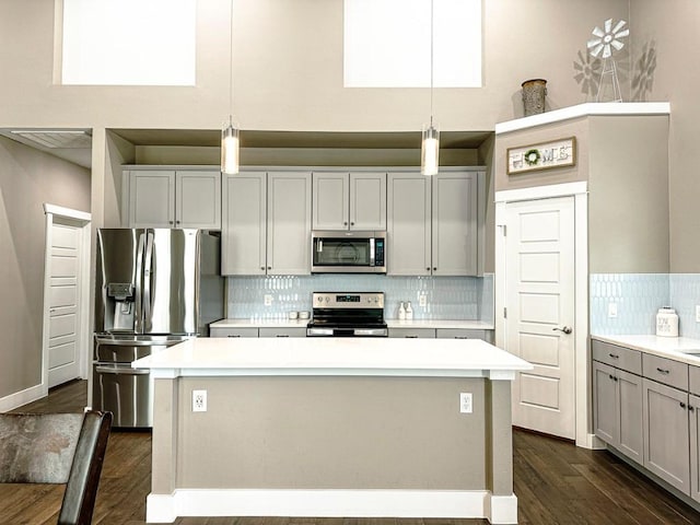 177 Mokulua Ln, Bastrop, TX 78602 - kitchen with stainless steel appliances, dark wood-type flooring, and light countertops