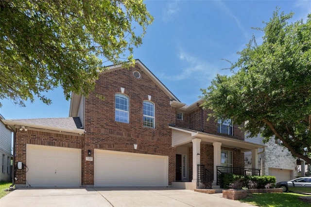 2817 Barefoot Ln, Round Rock, TX 78665 - view of front of house featuring brick siding, driveway, and an attached garage
