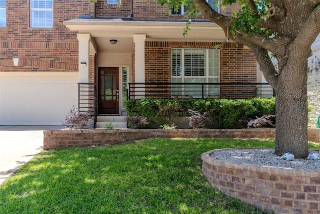 2817 Barefoot Ln, Round Rock, TX 78665 - entrance to property featuring brick siding, a garage, concrete driveway, and a lawn