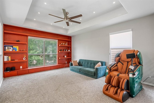 2817 Barefoot Ln, Round Rock, TX 78665 - living area featuring carpet flooring, a raised ceiling, a ceiling fan, built in shelves, and recessed lighting