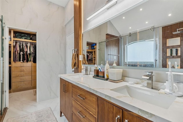 2817 Barefoot Ln, Round Rock, TX 78665 - bathroom featuring double vanity, a spacious closet, a shower stall, marble finish floors, and recessed lighting