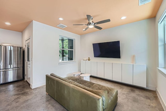 7311 Providence Ave Unit B, Austin, TX 78752 - living room featuring finished concrete flooring, ceiling fan, and recessed lighting