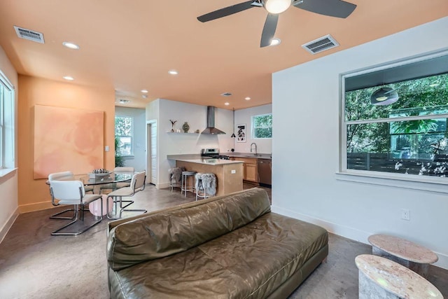 7311 Providence Ave Unit B, Austin, TX 78752 - living room with healthy amount of natural light, ceiling fan, and recessed lighting