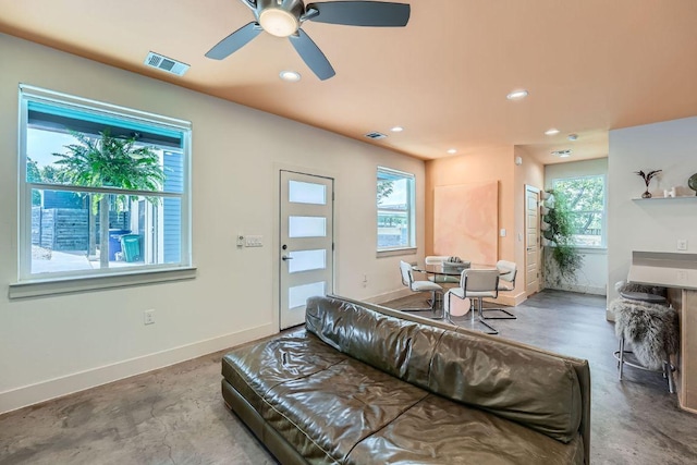 7311 Providence Ave Unit B, Austin, TX 78752 - living room featuring concrete flooring, recessed lighting, and ceiling fan
