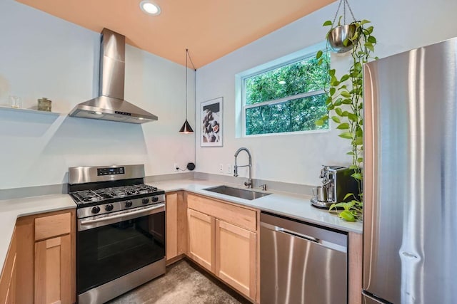 7311 Providence Ave Unit B, Austin, TX 78752 - kitchen featuring appliances with stainless steel finishes, wall chimney range hood, light countertops, and recessed lighting