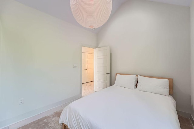 7311 Providence Ave Unit B, Austin, TX 78752 - bedroom with baseboards and high vaulted ceiling