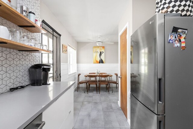 1807 Madison Ave, Austin, TX 78757 - kitchen featuring appliances with stainless steel finishes, white cabinetry, light countertops, a ceiling fan, and open shelves