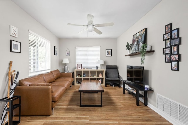 1807 Madison Ave, Austin, TX 78757 - living area featuring ceiling fan and wood finished floors