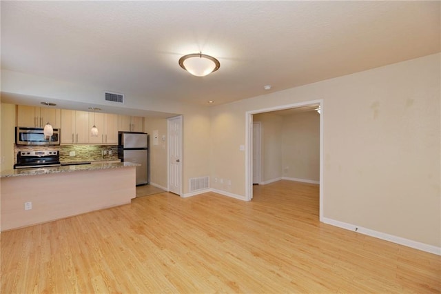 7685 Northcross Dr Unit 605, Austin, TX 78757 - unfurnished living room with light wood-type flooring
