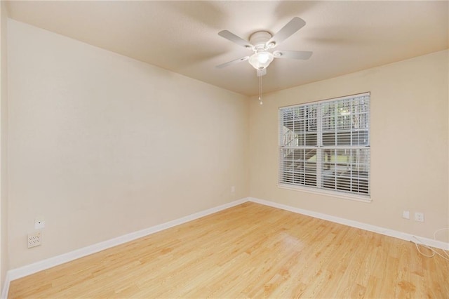 7685 Northcross Dr Unit 605, Austin, TX 78757 - spare room featuring wood finished floors and ceiling fan