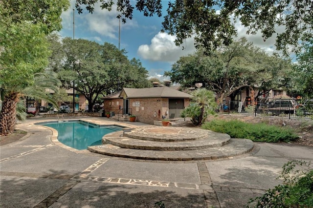 7685 Northcross Dr Unit 605, Austin, TX 78757 - community pool featuring a patio area