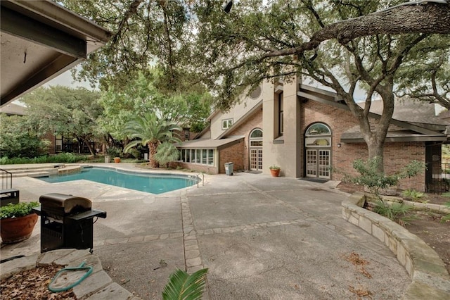 7685 Northcross Dr Unit 605, Austin, TX 78757 - outdoor pool featuring a patio area and french doors