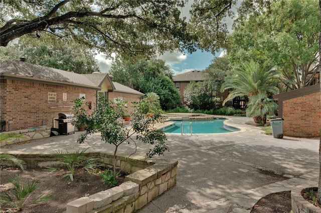 7685 Northcross Dr Unit 605, Austin, TX 78757 - swimming pool featuring a patio area