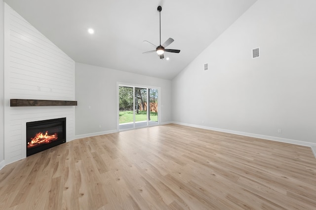 158 Loysoya St, Bastrop, TX 78602 - unfurnished living room featuring high vaulted ceiling, ceiling fan, a large fireplace, light wood finished floors, and recessed lighting