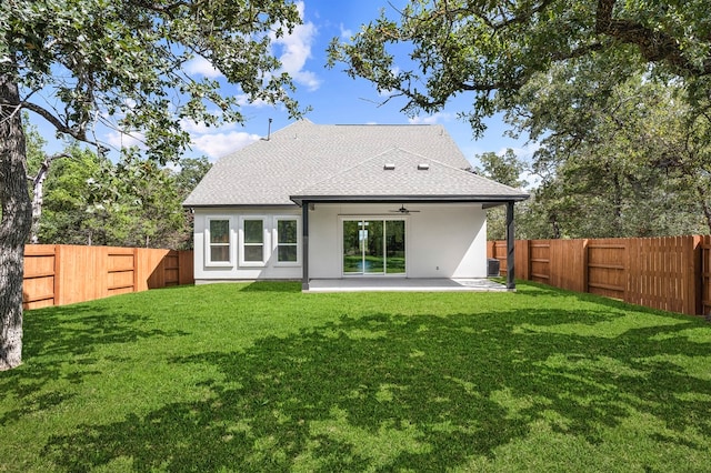 158 Loysoya St, Bastrop, TX 78602 - back of house with ceiling fan, a fenced backyard, a shingled roof, stucco siding, and a patio