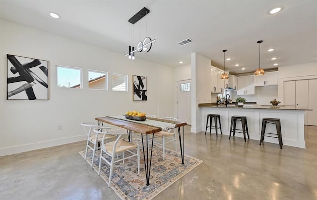 7306 Carver Ave Unit 1, Austin, TX 78752 - dining space featuring finished concrete floors and recessed lighting